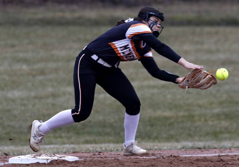 McHenry's Abby Geis tries to catch a foul ball during a non-conference softball game Tuesday March 22, 2022, between Richmond-Burton and McHenry at Richmond-Burton High School.
