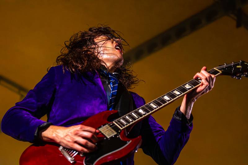 Kyle Lapato of Thunderstruck strums a guitar at the annual Cops for Cancer event on Friday, July 25, 2025, at Cerri Memorial Park in Cedar Point.