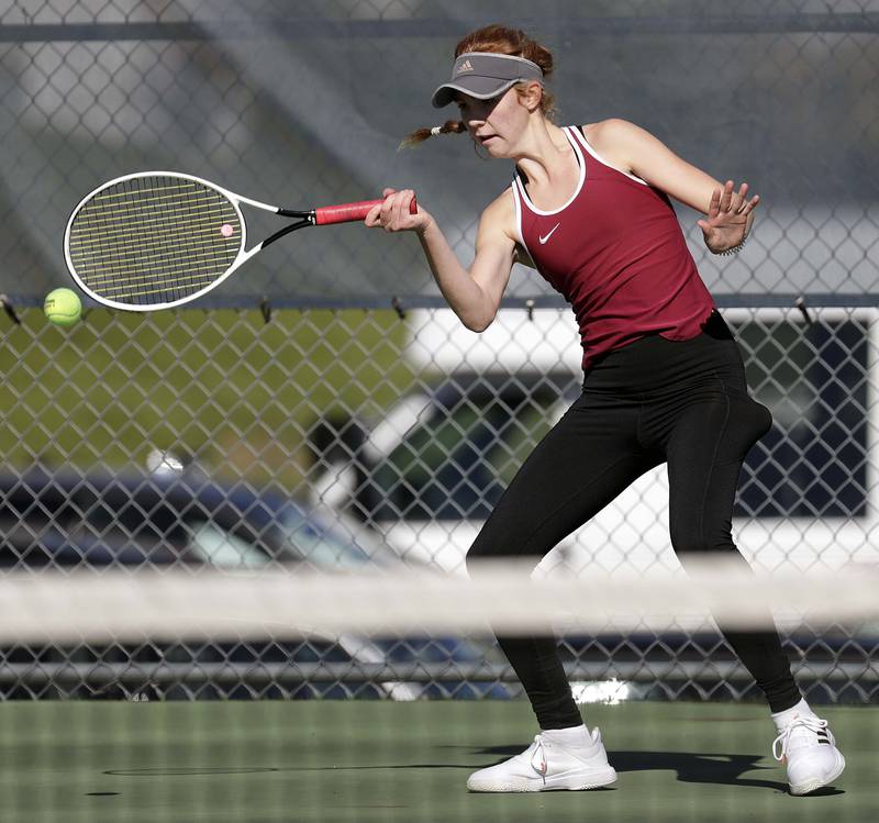 Plainfield North's Jessica Kovalcik returns a shot to Hinsdale Central's Anna Wiskowski, during the third place 2A singles match at the IHSA State girls tennis finals at Buffalo Grove High School Saturday October 23, 2021.