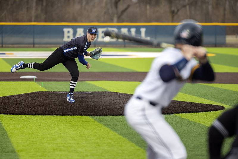 Newman’s Evan Bushman fires a pitch against Sterling Tuesday, March 18, 2025.