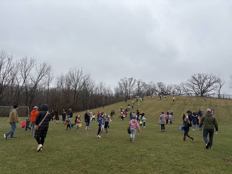 People hunt for Easter eggs at the Easter Egg Hunt at Sunnyside Memorial Park in Johnsburg, Saturday, April 4, 2026.