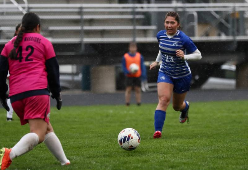 Princeton's Miyah Fox runs down the ball against Sterling Thursday at Bryant Field. The Tigresses won 3-1.