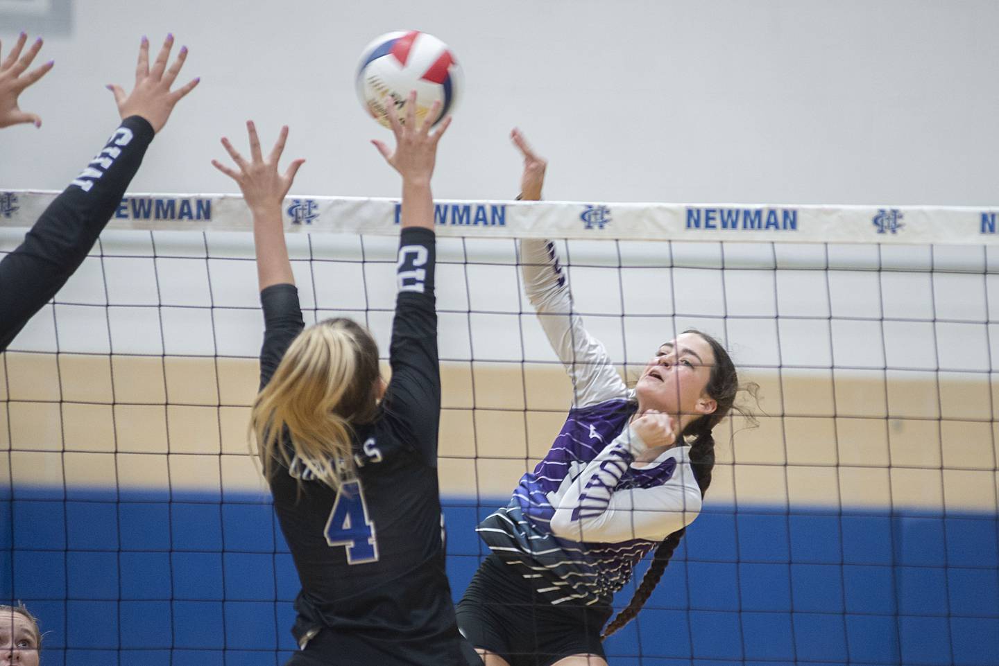 Dixon’s Joey Brumbly hammers a ball against Newman Monday, Aug. 29, 2022.