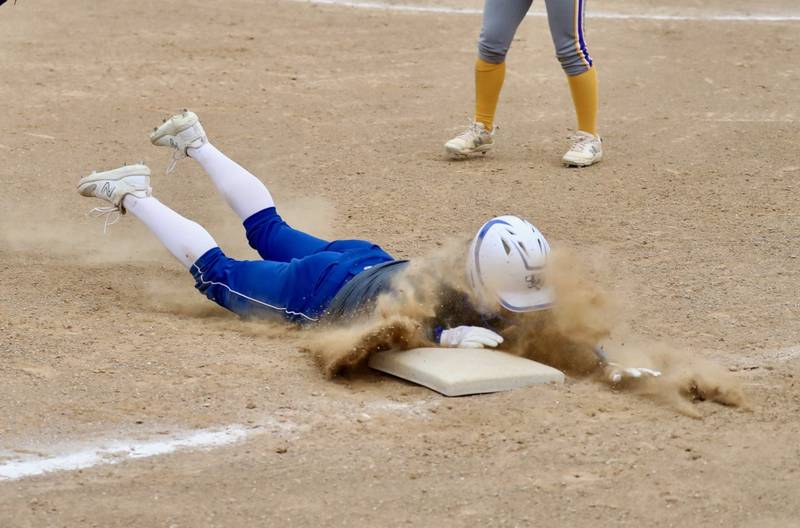 Princeton's Makayla Hecht slides into third  base Tuesday.
