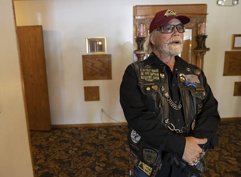 David Gier, senior ride captain for the Patriot Guard, talks Thursday, May 30, 2024 about what an honor it is to bring home heroes such as Richard Seloover.
