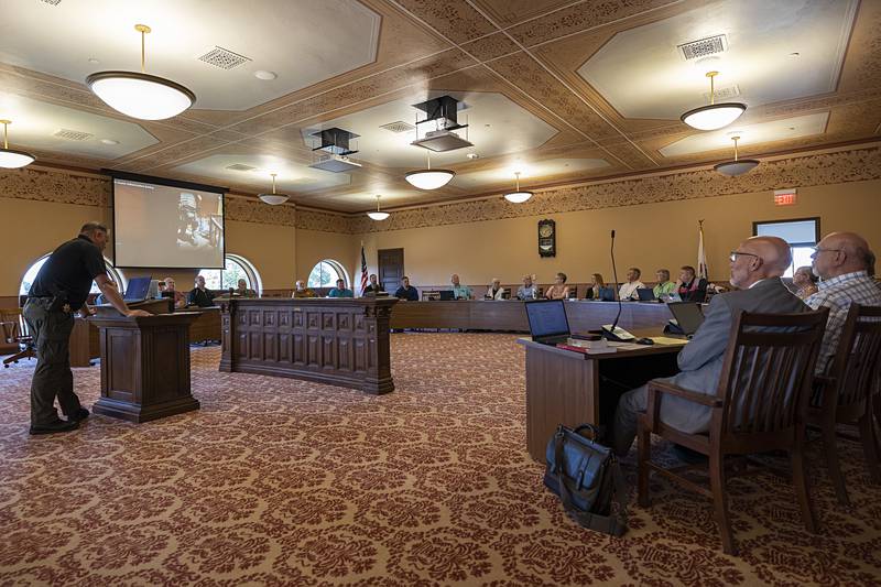 Ogle County board members watch body cam video Tuesday, June 18, 2024 from last week’s shooting at Lost Lake. Sheriff Brian VanVickle presented the board with the video.