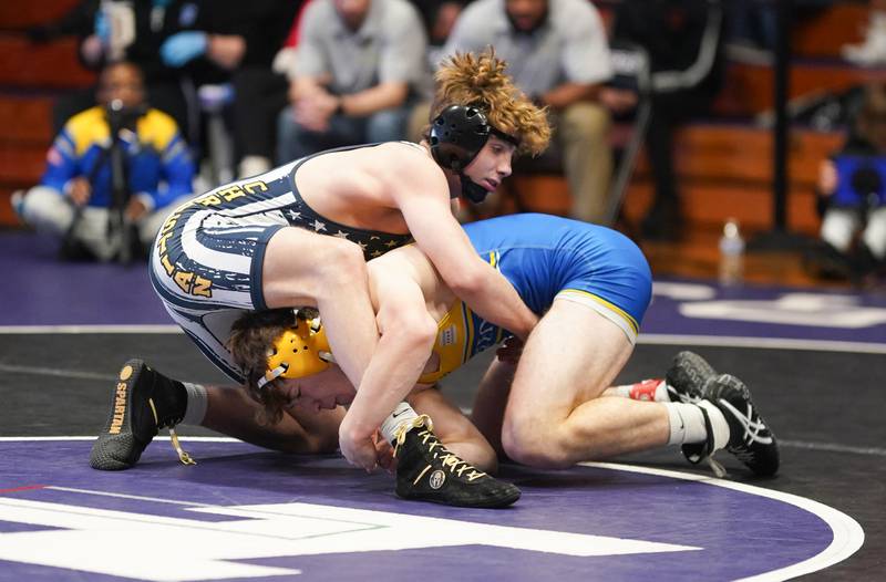 Yorkville Christian’s Robby Nelson (left) competes against Chicago DeLasalle’s Nichols Arventis in a 157 pound championship match during the Reaper Classic Wrestling meet at Plano High School on Saturday, Dec 9, 2023.