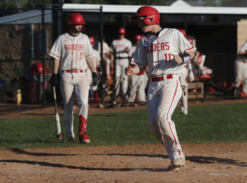 Huntley's Brody Peters comes home to score Huntley’s third run during a Fox Valley Conference baseball game against Dundee-Crown on Friday, May 9, 2025, at Huntley High School.