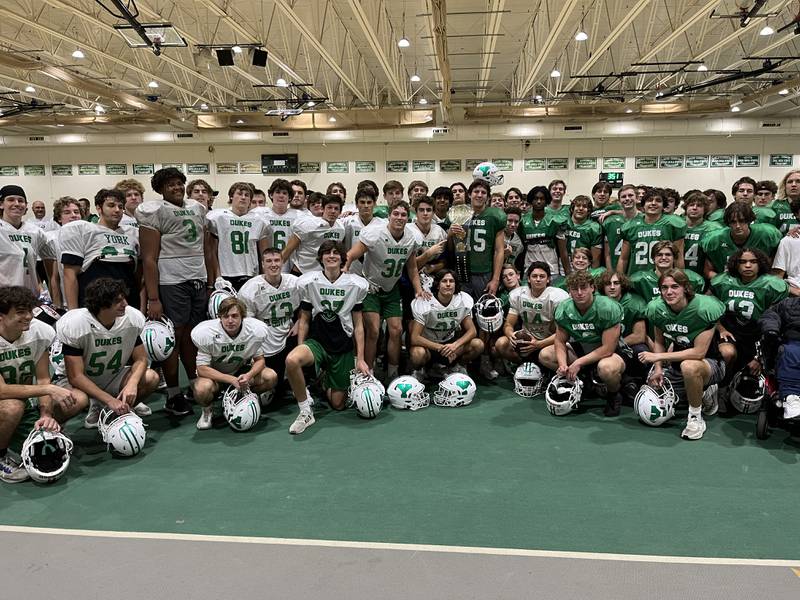 York senior defensive lineman Ashton Nawrocki (middle, with belt) is the Friday Night Drive Team of the Week MVP for Week 7. He made seven tackles, four tackles for loss, and had two sacks and two quarterback hurries in a 31-7 win over Hinsdale Central.