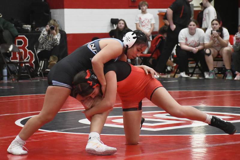 Bradley-Bourbonnais' Sophia Domont wraps her arms low around Kankakee's Tamira Welch during the All-City wrestling meet on Wednesday, Dec. 3, 2025.