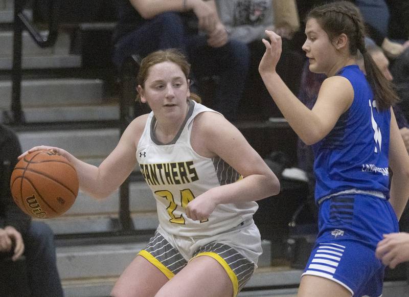 Putnam County's Gracie Ciucci dribbles around Newark's Brooklyn Hatteberg during the Class 1A Regional final game on Thursday, Feb. 16, 2023 at Putnam County High School.