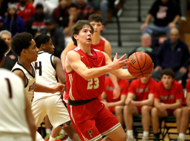 Palatine’s Carter Monroe goes up for a shot during the Jack Tosh Holiday Classic semifinals against Bolingbrook at York High School in Elmhurst on Friday, Dec. 29, 2023.