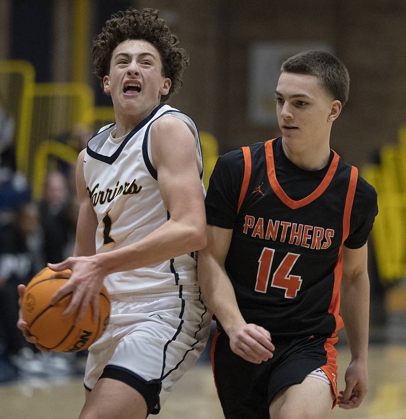 Sterling’s Brady Berlin looks towards the hoop while being guarded by UT’s Leo Sim Tuesday, Jan. 14, 2025.