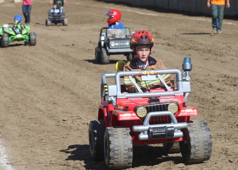 Aiden Neuses of Wyanet, drives his firefighter Power Wheels jeep during the 170th annual Bureau County Fair on Saturday, Aug. 23, 2025 in Princeton.