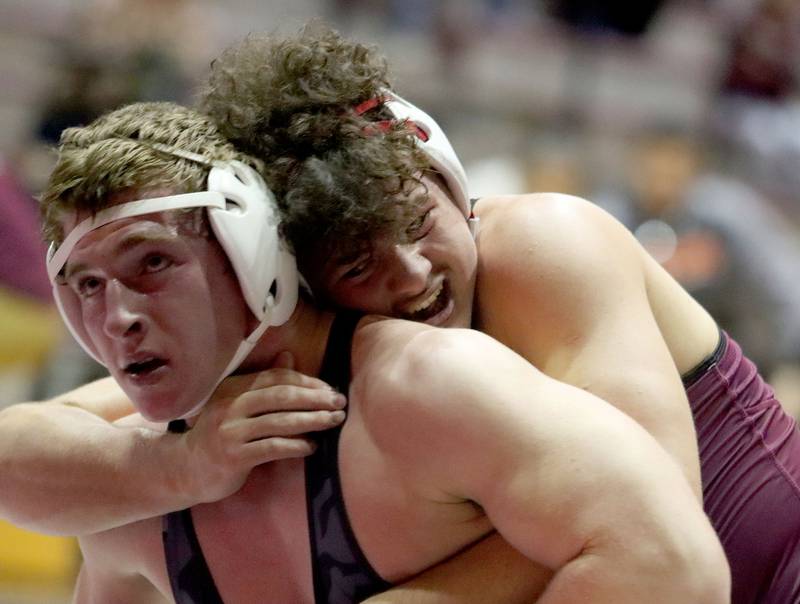 McHenry’s Henry Mitchell, front, battles Prairie Ridge’s Frank Matviychuk  at 215 pounds in varsity boys wrestling on Thursday, Jan. 8, 2026 at Prairie Ridge High School in Crystal Lake.