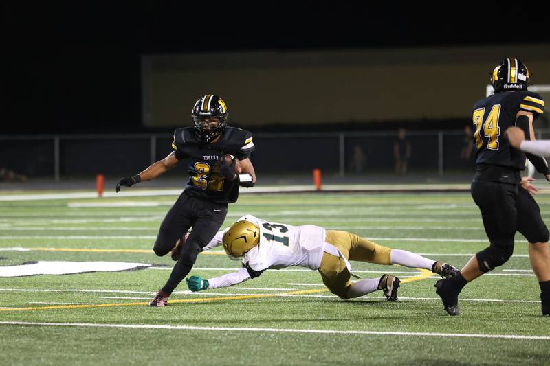 Herscher's Alek Draper runs the ball during the Tigers' 45-28 loss to Bishop McNamara on Friday, Sept. 5, 2025.