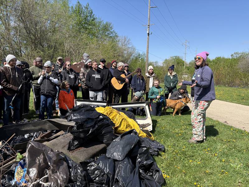 Organizer Natalie Martin talks to a group of volunteers during the 10th annual Perfectly Flawed Earth Day cleanup at the I&M Canal’s Lock 14 on Saturday, April 18, in La Salle.