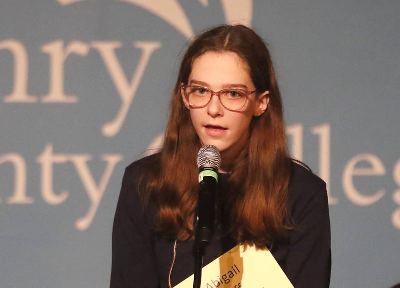 Abigail Huff of Saints Peter and Paul Catholic School in Cary competes in the McHenry County Regional Office of Education's 2023 spelling bee Wednesday, March 22, 2023, at McHenry County College's Luecht Auditorium in Crystal Lake.