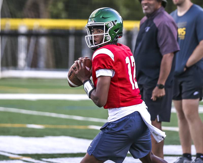 AJ Rayford drops back to pass at Glenbard West football practice, Wednesday, Aug 21, 2025  in Glen Ellyn.