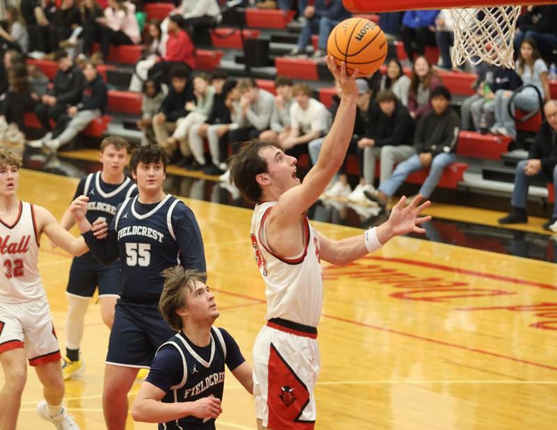 Hall's Braden Curran runs in to score on a layup against Fieldcrest during the Colmone Classic on Friday, Dec. 12, 2025 at Hall High School.