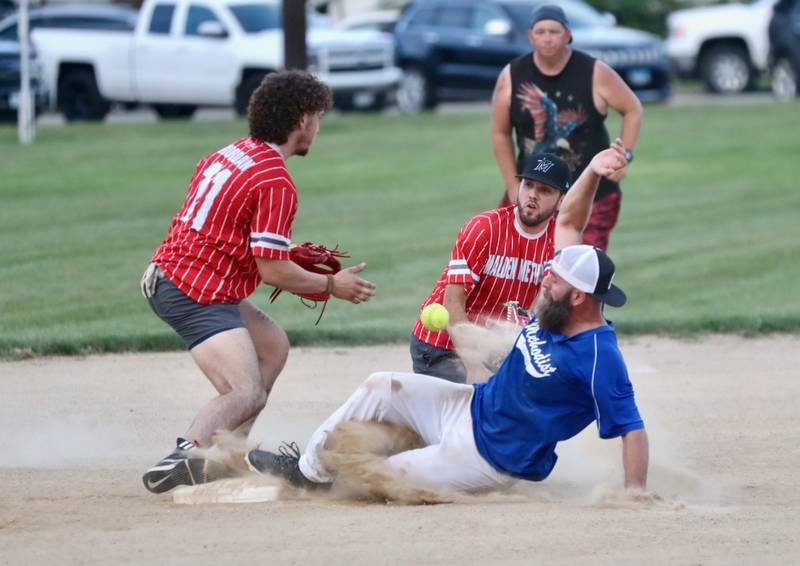 United Methodist's Jerry Lanham slides in to second base as Malden's Sean Riordan and Austin DeBates try to corral the throw Thursday at Westside Park.