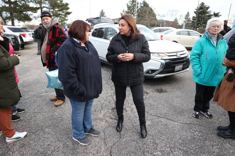 Bolingbrook Mayor Mary Alexander-Basta (right) speaks with Kathy Freeberg, on of the evening organizers, before the candlelight vigil for the victims of the March 5th shooting on Wednesday, March 8th, 2023 in Bolingbrook.