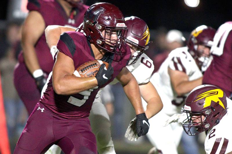 Marengo’s Isaac Anthony runs the ball against Richmond-Burton in varsity football at Rod Poppe Field in Marengo Thursday night.