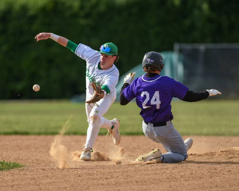York's Luke Pieczynski, left, waits for the ball while Downers Grove North's Russ Oros (24) slides into second base safely during the game on Monday May 19, 2025, held at York High School in Elmhurst.