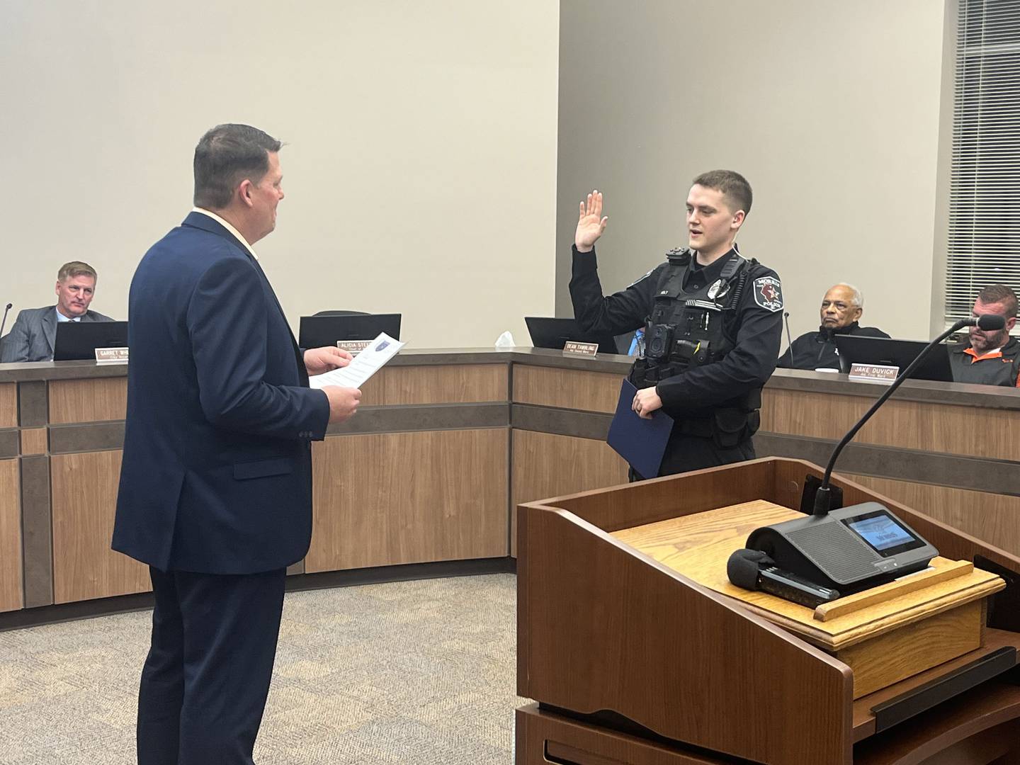 New Officer Marshall Holt is sworn in by Mayor Chris Brown during Monday, Feb., 17's city council meeting.