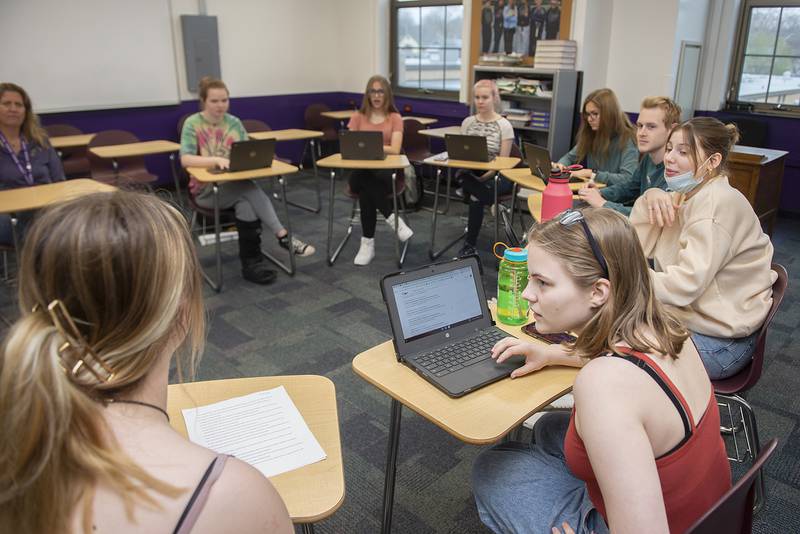 Abby Tate pulls up the laptop in her publications class at Dixon High School to research a current news event on Friday, April 22, 2022.