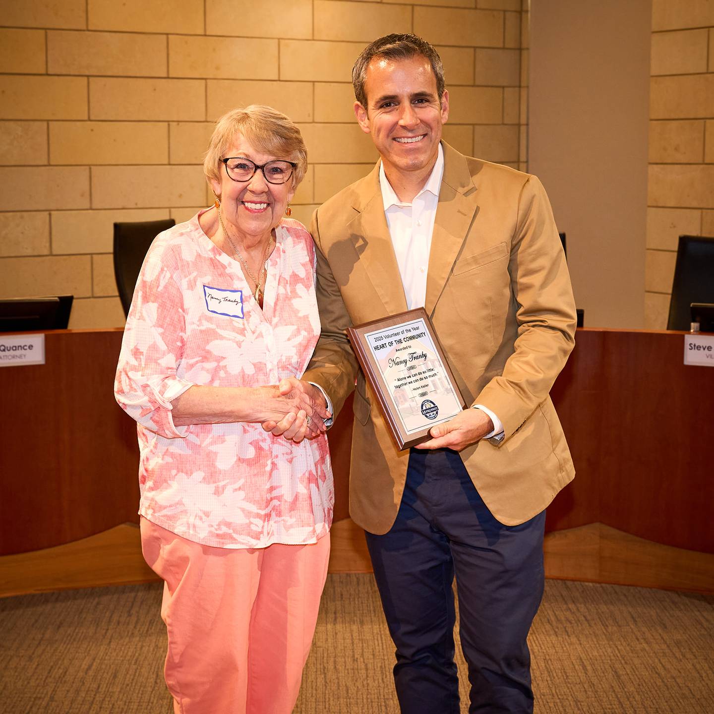 Nancy Tranby, of Montgomery, is bestowed the "Heart of the Community" award by Montgomery Village President Matt Brolley during the town's Volunteer of the Year Recognition at Village Hall.