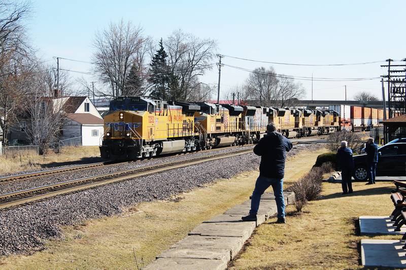 Railroad enthusiasts gather at the Ken Wise Railroad Park in Rochelle to see interesting sights on lines, such as this six-engine lead group hauling intermodal freight west from Chicago.