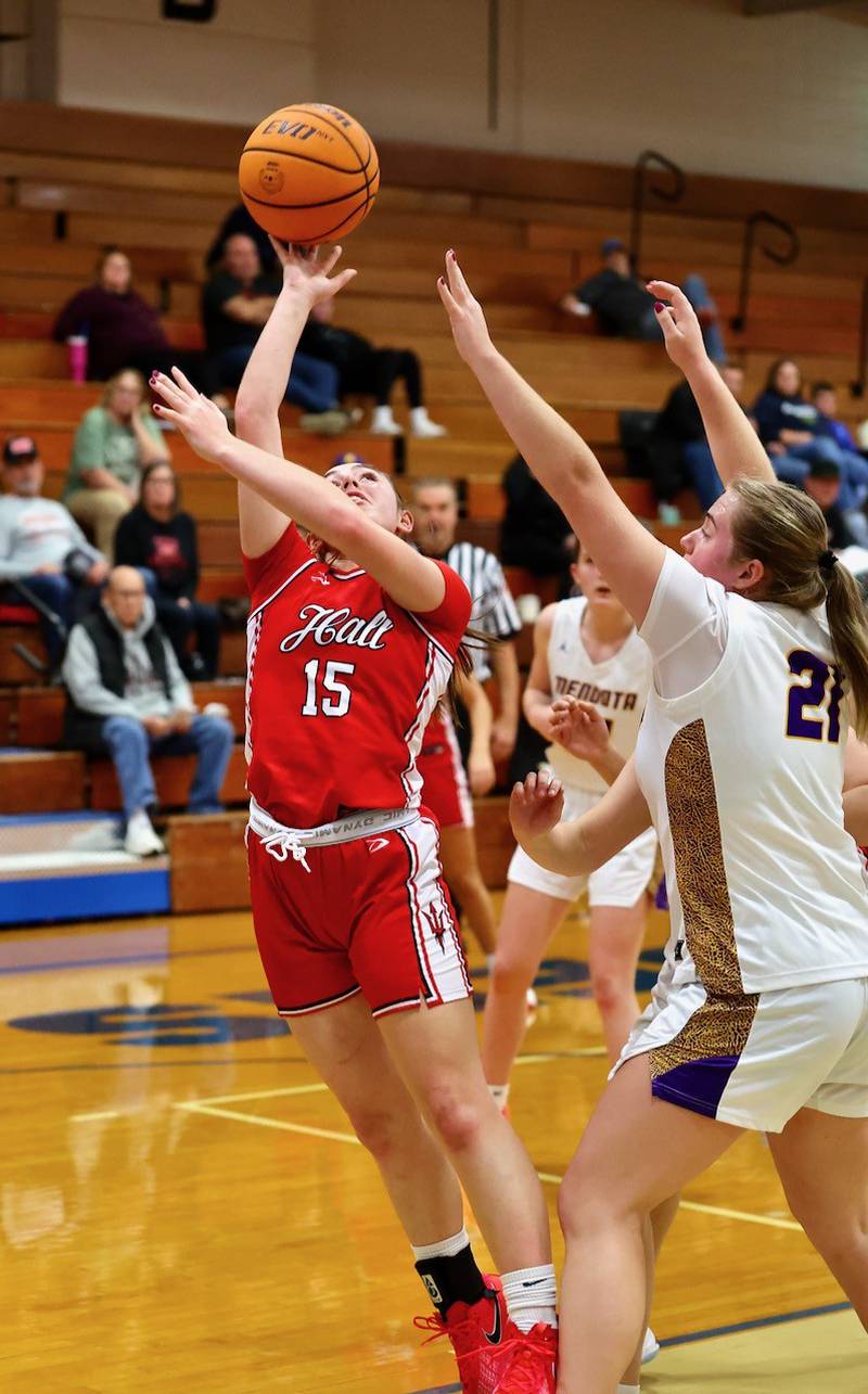 Hall's Natalia Zamora shoots over Mendota's Addi Perryman Thursday night in Princeton. The Red Devils won 48-22 to improve to 2-0.