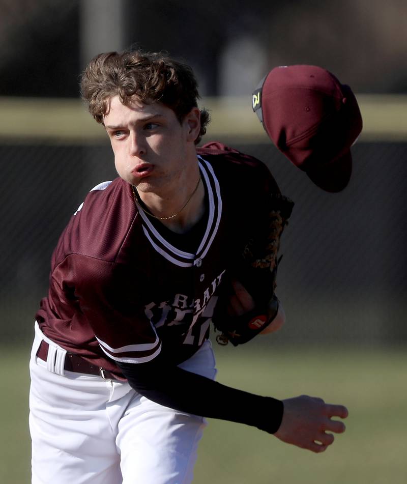 A gust of wind blows off Prairie Ridge’s Colt Zaleski’s cap as he throws a pitch during a Fox Valley Conference baseball game against Prairie Ridge on April 8, 2026, at Prairie Ridge High School.