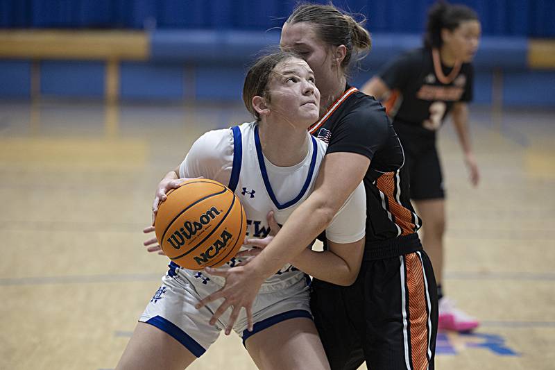 Newman’s Lucy Oetting works against Kewanee’s Anahi Guerrero-Lopez Thursday, Feb. 6, 2025, at Newman High School.