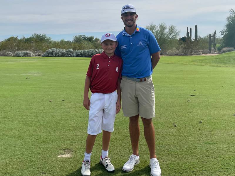 Michael Jorski, of Clarendon Hills, with PGA golfer Max Homa. Jorski won the National Drive, Chip and Putt title at Augusta National Golf Club this month.
