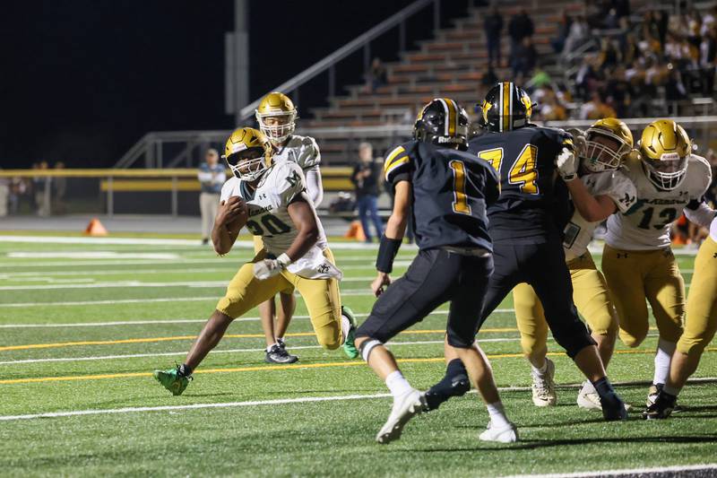 Bishop McNamara's Jordan Callaway looks toward the end zone on a run during the Fightin' Irish's 45-28 victory over Herscher on Friday, Sept. 5, 2025.