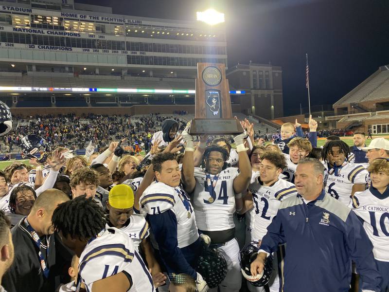 IC Catholic celebrates winning the Class 3A state championship after defeating Williamsville 48-17, Friday, Nov. 25., 2022, in Champaign.