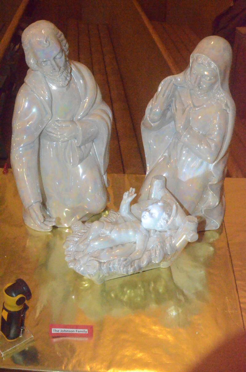 A nativity set loaned by the Johnson family of Oswego was among 60 sets displayed Friday evening, Dec. 5, 2025 at Church of the Good Shepherd United Methodist of Oswego. The sets were showcased on boards across pews in the church sanctuary