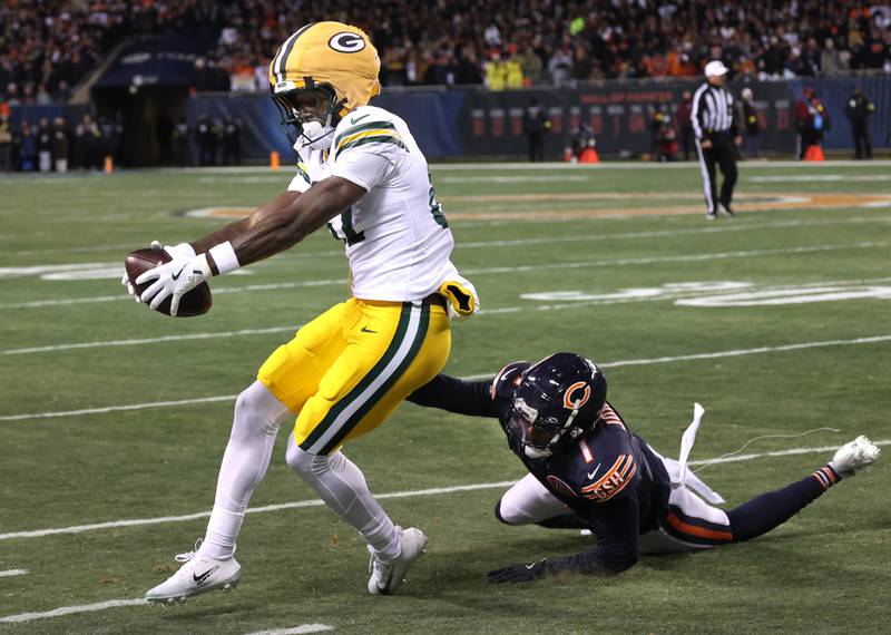 Green Bay Packers wide receiver Romeo Doubs makes a catch along the sidelines in front of Chicago Bears cornerback Jaylon Johnson Saturday, December 20, 2025, during their game at Soldier Field in Chicago.