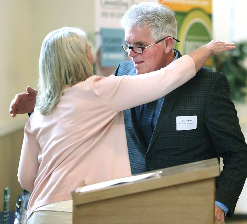 Sycamore Chamber of Commerce Clifford Danielson Outstanding Citizen Award winner Thomas Doty, of Doty & Sons, gets a hug from past winner Kathy Countryman after she introduced him during the 106th Annual Chamber Meeting Thursday, March 2, 2023, in Memorial Hall at St. Mary's Catholic Church in Sycamore.