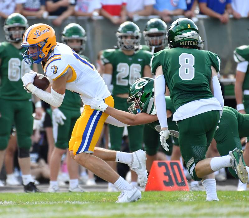 Lyons Township’s Grant Smith surges for extra yards after a catch during a game against Glenbard West on September 27, 2025 at Glenbard West High School in Glen Ellyn.