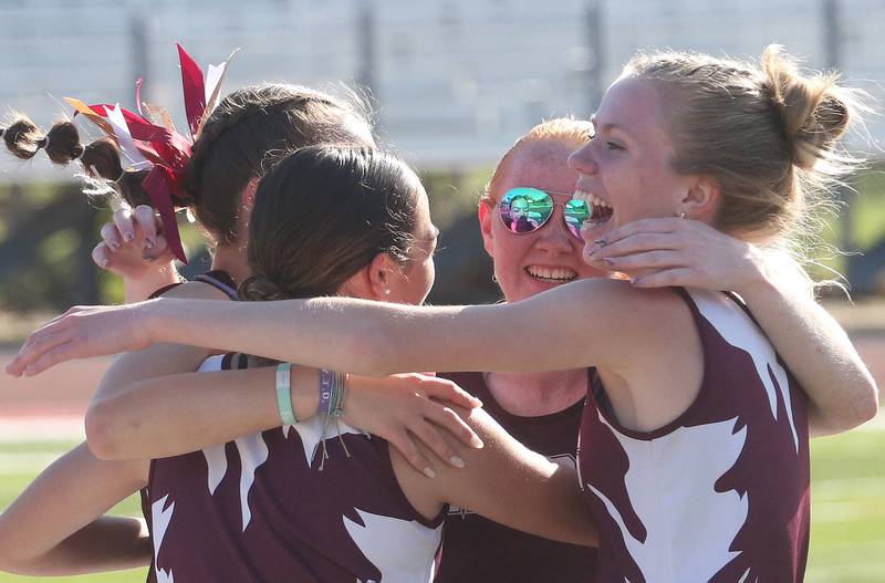 Members of the Morris 4x800 relay team (from left) Leah Ortiz, Paityn Valentine, Makensi Martin and Aubrey Lines celebrate after winning the event during the Interstate 8 Conference girls track championship on Friday, May 9, 2025 at Morris High School.