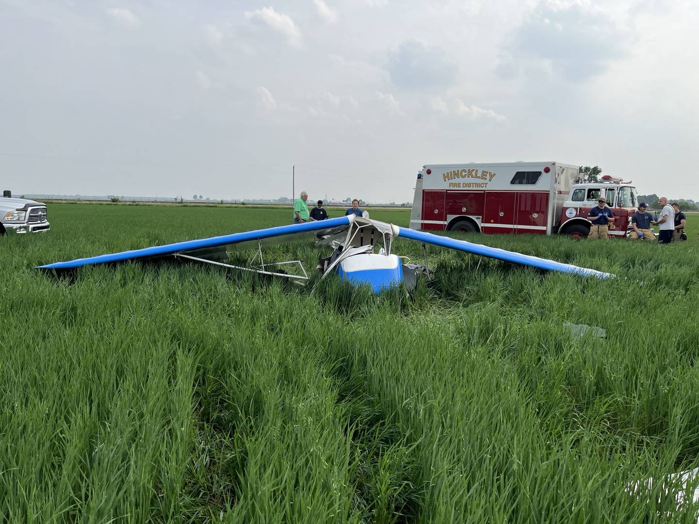 The remains of a 1946 Aeronca Champion 7AC single-engine plane lay in a farm field west of Hinckley Airfield on Saturday, June 7, 2025. The crash killed a 51-year-old pilot from Maple Park and injured a 3-year-old passenger, according to the DeKalb County Sheriff's Office.