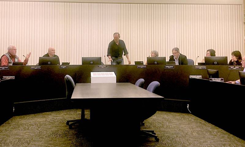 Lockport Mayor Steven Streit rises during a dispute with Aldermen Darren Deskin and Patrick MacDonald about the future of the Lockport Square Development during the Jan. 3 City Council meeting.