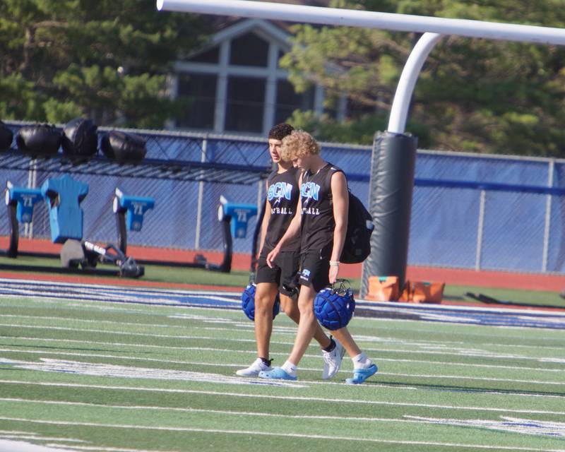 St. Charles North's JT Padron and Keaton Reinke walk on the field to the first practice on Monday, Aug.11,2025 in St. Charles.
