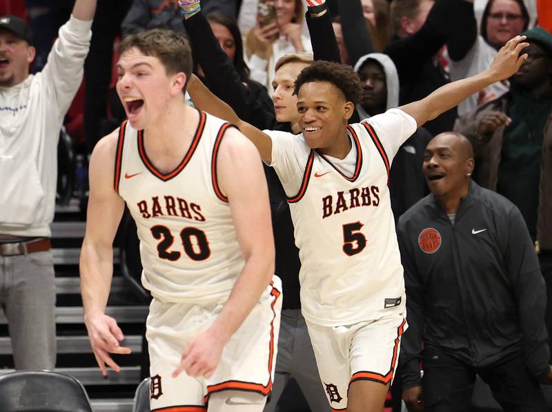DeKalb's Lukas Stubblefield (left) and DeKalb's Bryan Miller celebrate their win over Sycamore Friday, Jan. 30, 2026, during the FNBO Challenge at the Convocation Center at Northern Illinois University in DeKalb.