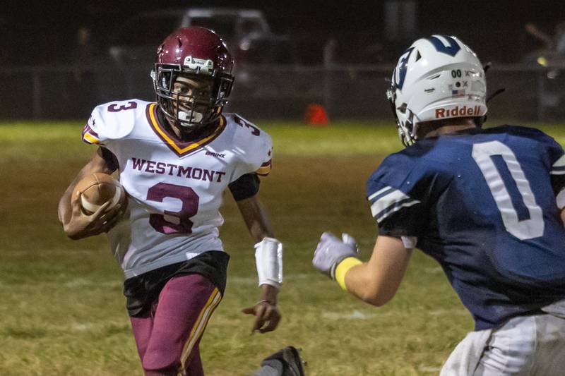 Konor Rogers of Westmont runs ball whilst Lucas Anson of Fieldcrest attempts to tackle him on Friday, September 20, 2024 at Fieldcrest high school in Minonk.