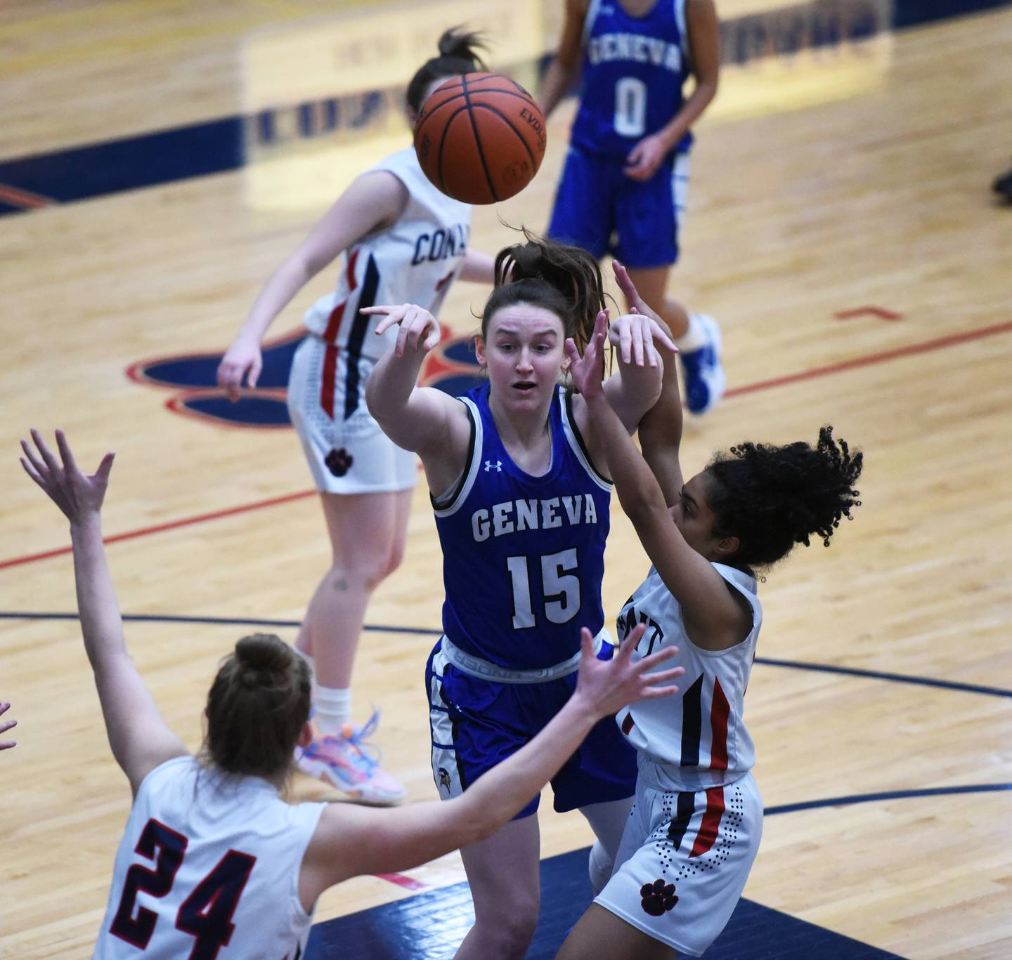 Geneva's Cassidy Arni (15) passes around the Conant defense during Friday’s IHSA Class 4A girls basketball regional championship in Hoffman Estates.