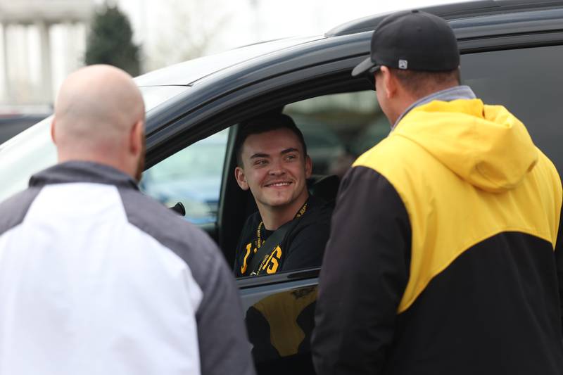 Lawson Sizemore is greeted by several Joliet West staff as he pulls into his old high school in his new adaptable van on Tuesday, April 25, 2023 in Joliet.
